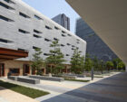 Public visitors to the complex enter through a pavilion at the east edge of the site. In this low-lying structure security personnel conduct the required clearances under an elegant and efficient enclosure that is wrapped in earthen-hued Corten steel.  The compound’s architectural ethos is formed around a clear commitment to environmental sustainability that includes the extensive use of local materials. The Consulate Plaza is shaded by trees and manages storm water by means of riparian plants and bioswales that are indigenous to Guangdong Province. All roofs perform a dual role of solar heat rejection and reducing the storm surge impact from torrential rains.